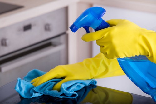 Office cleaning team sanitising desks and communal areas in Haringey