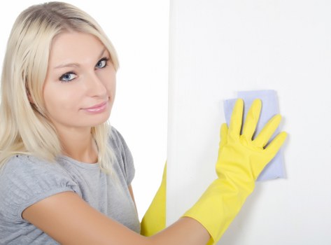 Trained technician using protective equipment during carpet cleaning